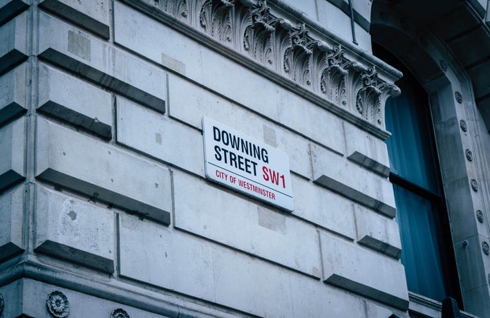 an outside shot of Downing Street, London, UK, showing its street sign