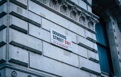 an outside shot of Downing Street, London, UK, showing its street sign