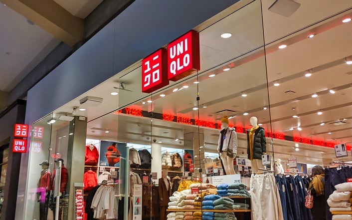 Bellevue, WA / USA - November 1st, 2019: Uniqlo clothing store in a mall, with lots of different fall and winter clothing on display and on sale.