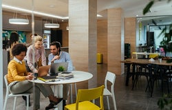 Group of colleagues doing business at a cafe