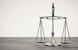 silver balancing scales on a desk